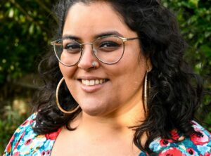 headshot of Lena smiling at the camera